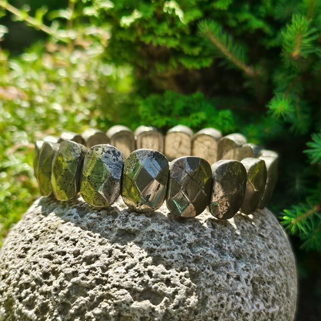 Golden pyrite bracelet with flat faceted slabs, shimmering with earthy gold tones for confidence and abundance.