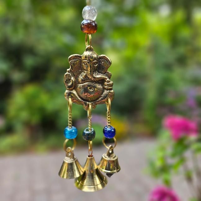 Brass Ganesh wind chimes with glass beads and bells, 8 inches long, for blessings and harmony.