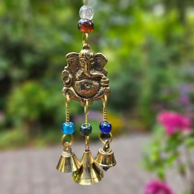 Brass Ganesh wind chimes with glass beads and bells, 8 inches long, for blessings and harmony.