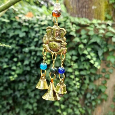 Brass Ganesh wind chimes with glass beads and bells, 8 inches long, for blessings and harmony.