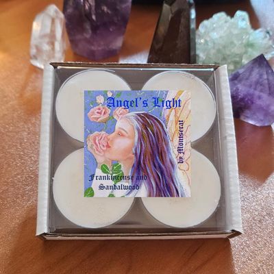 Angel’s Light organic soy candle with Frankincense and Sandalwood for peace, sweetness, and divine comfort.