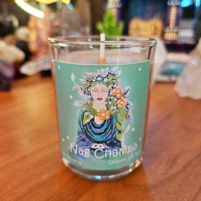 Nag Champa soy candle with sandalwood, frangipani, and Buddha of the Garden artwork in a reusable glass jar.