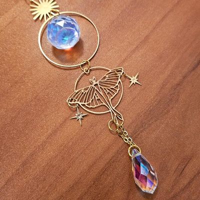 Gold Luna Moth suncatcher with celestial symbols and faceted crystals for moon magic and rainbow light.