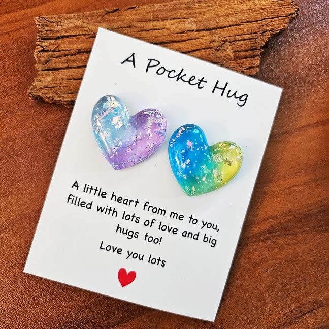 Colorful resin Heart Pocket Hugs with tiny inspiring note cards for comfort and encouragement.