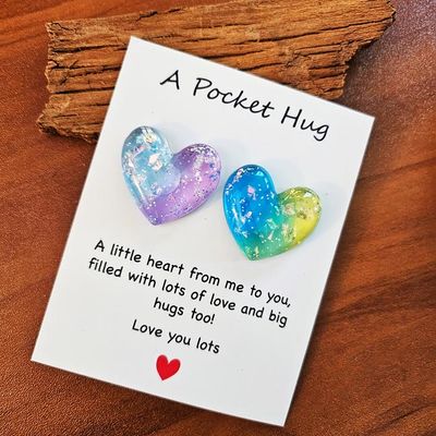Colorful resin Heart Pocket Hugs with tiny inspiring note cards for comfort and encouragement.