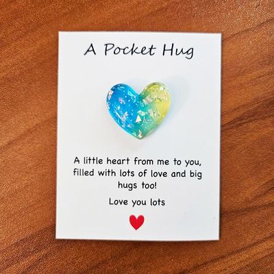 Colorful resin Heart Pocket Hugs with tiny inspiring note cards for comfort and encouragement.