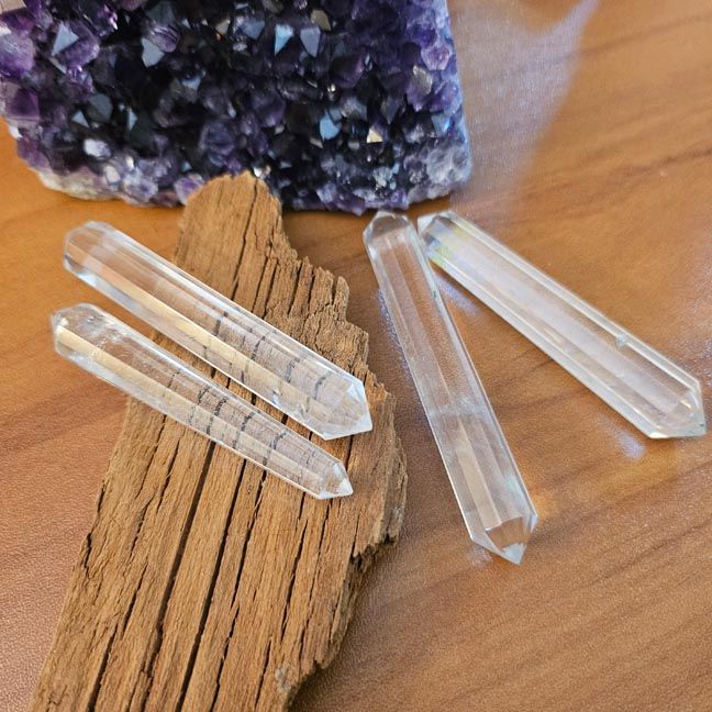 Clear quartz Vogel wand with 12 facets for energy direction, healing, and manifestation.