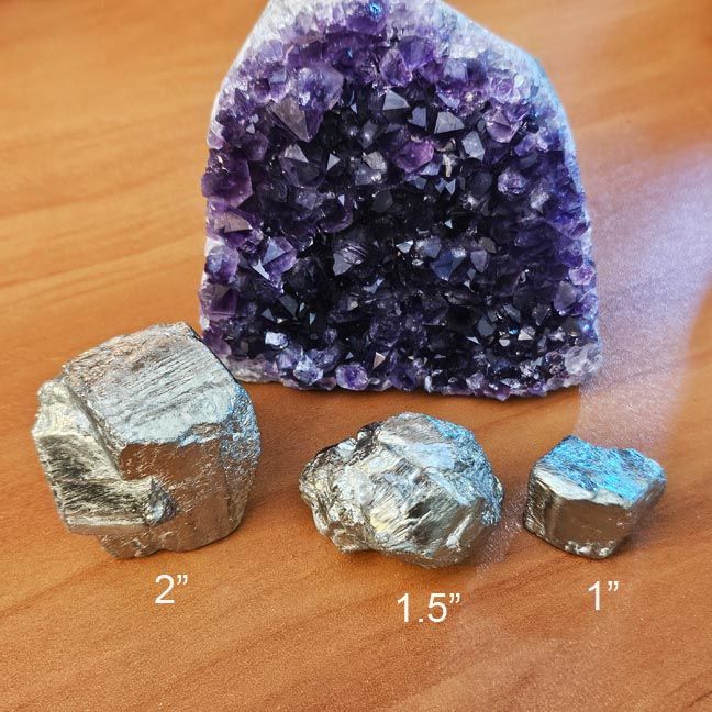 Raw pyrite crystal in three sizes for abundance, confidence, and protection.