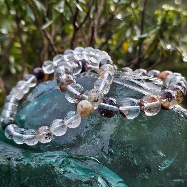 Shaman Quartz bracelets with moss‑like inclusions symbolizing Earth wisdom and spiritual insight.