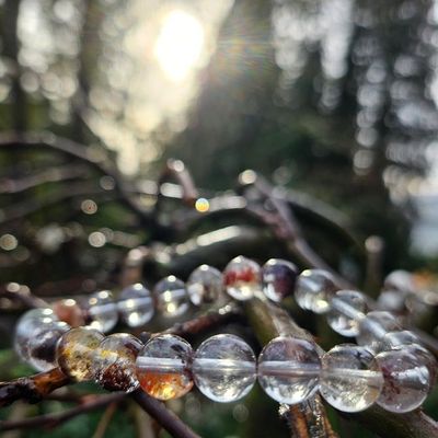 Shaman Quartz bracelet with moss‑like inclusions symbolizing Earth wisdom and spiritual insight.