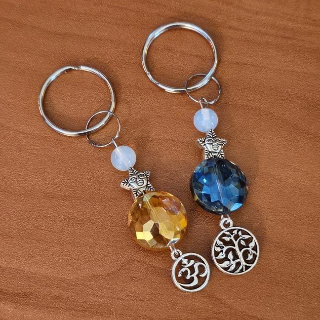 Whimsical key chains with sparkling faceted aura beads, star accents, opalite, and silver charms.