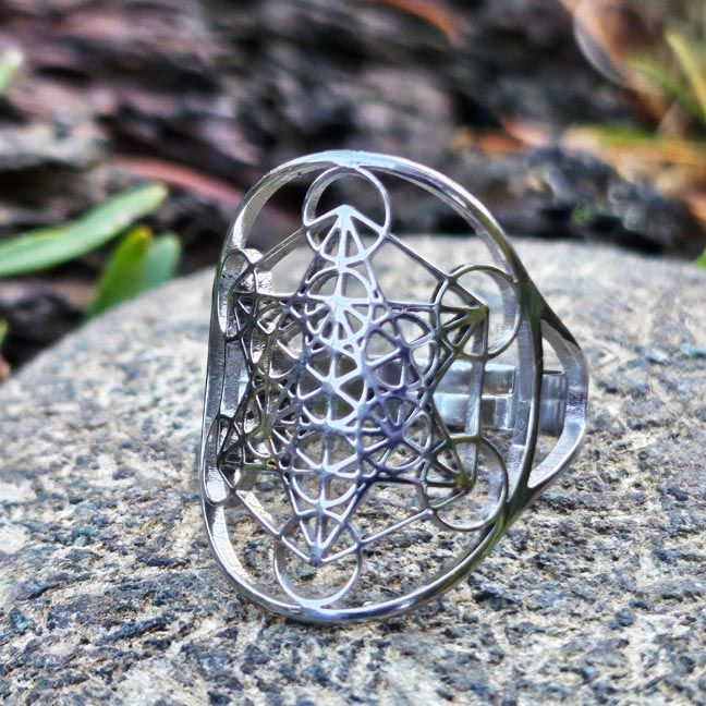 Adjustable stainless steel ring engraved with Metatron’s Cube sacred geometry symbol.