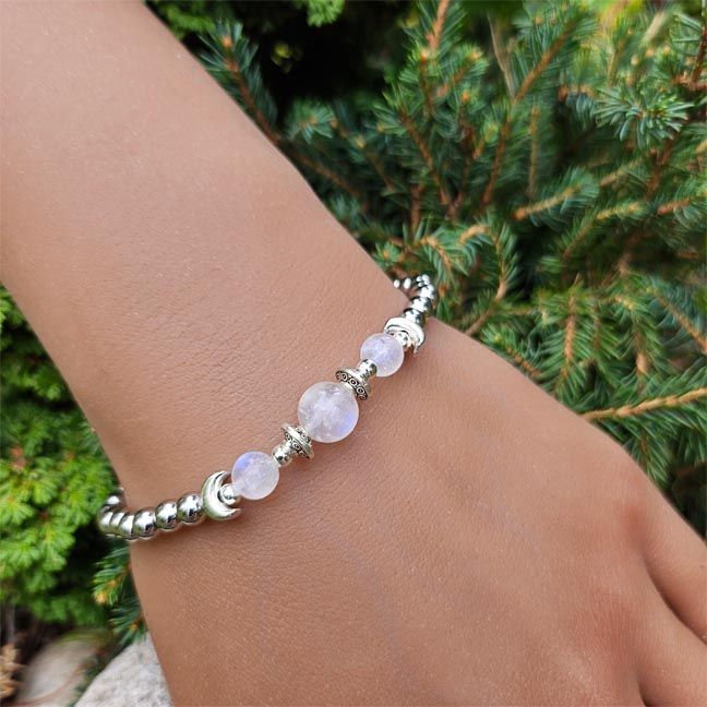 Rainbow Moonstone bracelet with crescent moon beads and stainless steel accents.