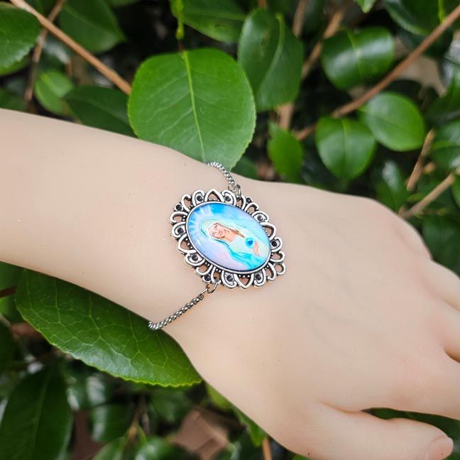 Madonna of the Healing Earth medallion bracelet with sliding stainless steel chain, symbolizing peace and unity.