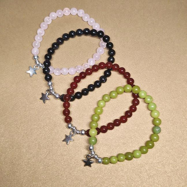 Starfield bracelet with 6mm natural gemstones and a silver star charm in Carnelian, Rose Quartz, or Canada Jade.