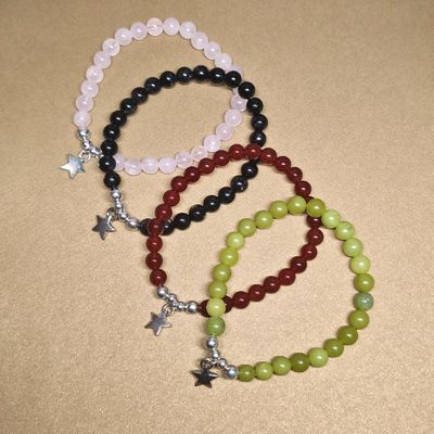 Starfield bracelet with 6mm natural gemstones and a silver star charm in Carnelian, Rose Quartz, or Canada Jade.