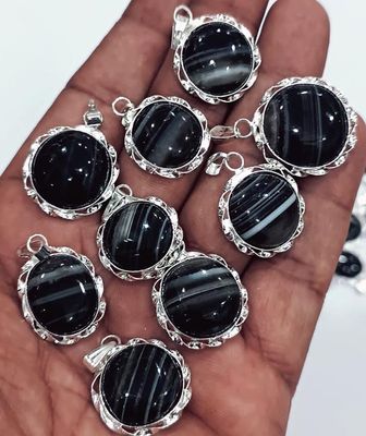 Round Black Sulemani pendant in silver plating with 18" chain, symbol of protection and grounding.