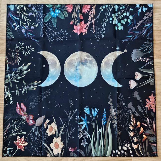 Triple Moon altar cloth with lunar phases and botanical night‑sky florals, 18×18 polyester.