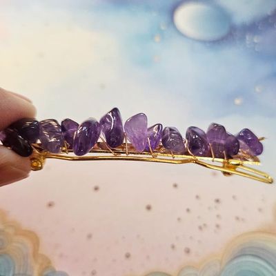 Gold wire‑wrapped hair clip with deep amethyst chips, measuring about 2 inches, displayed on a neutral background.