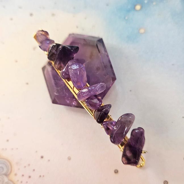 Gold wire‑wrapped hair clip with deep amethyst chips, measuring about 2 inches, displayed on a neutral background.