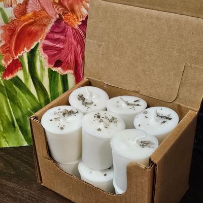 Twelve White Sage organic soy votives topped with dried sage leaves for cleansing and purification.