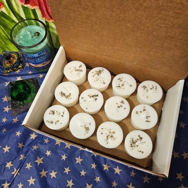 Twelve White Sage organic soy votives topped with dried sage leaves for cleansing and purification.