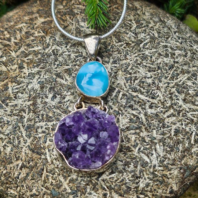 Handmade sterling silver pendant with a 1/2" Larimar cabochon and round 3/4" Amethyst cluster on an 18" chain.