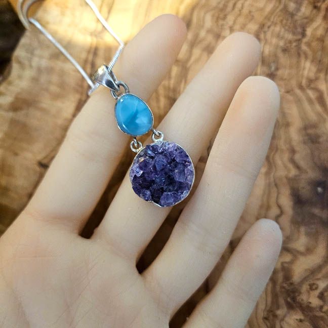 Handmade sterling silver pendant with a 1/2" Larimar cabochon and round 3/4" Amethyst cluster on an 18" chain.
