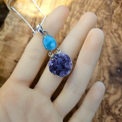 Handmade sterling silver pendant with a 1/2" Larimar cabochon and round 3/4" Amethyst cluster on an 18" chain.