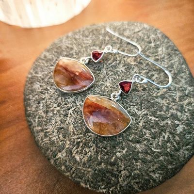 Handmade sterling silver earrings with faceted Garnet and ¾" Fire Quartz stones, 2" long including hoops.