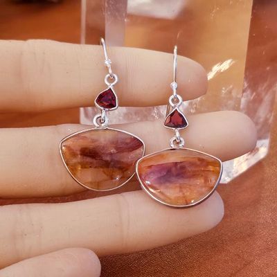 Handmade sterling silver earrings with faceted Garnet and ¾" Fire Quartz stones, 2" long including hoops.