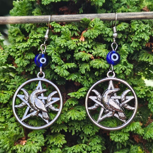 Crow Guardian Totem Earrings with blue Evil Eye bead, crow and pentagram charm, shown in gunmetal finish