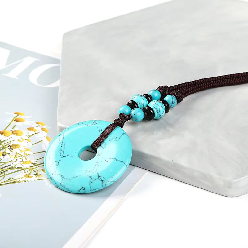 Türkis (synth.)  Stein Donut 40mm der Stein für Empathie und romantische Liebe