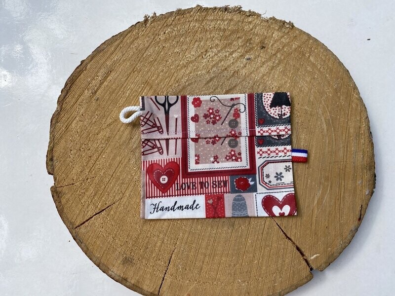 Pochette enduite à motifs couture