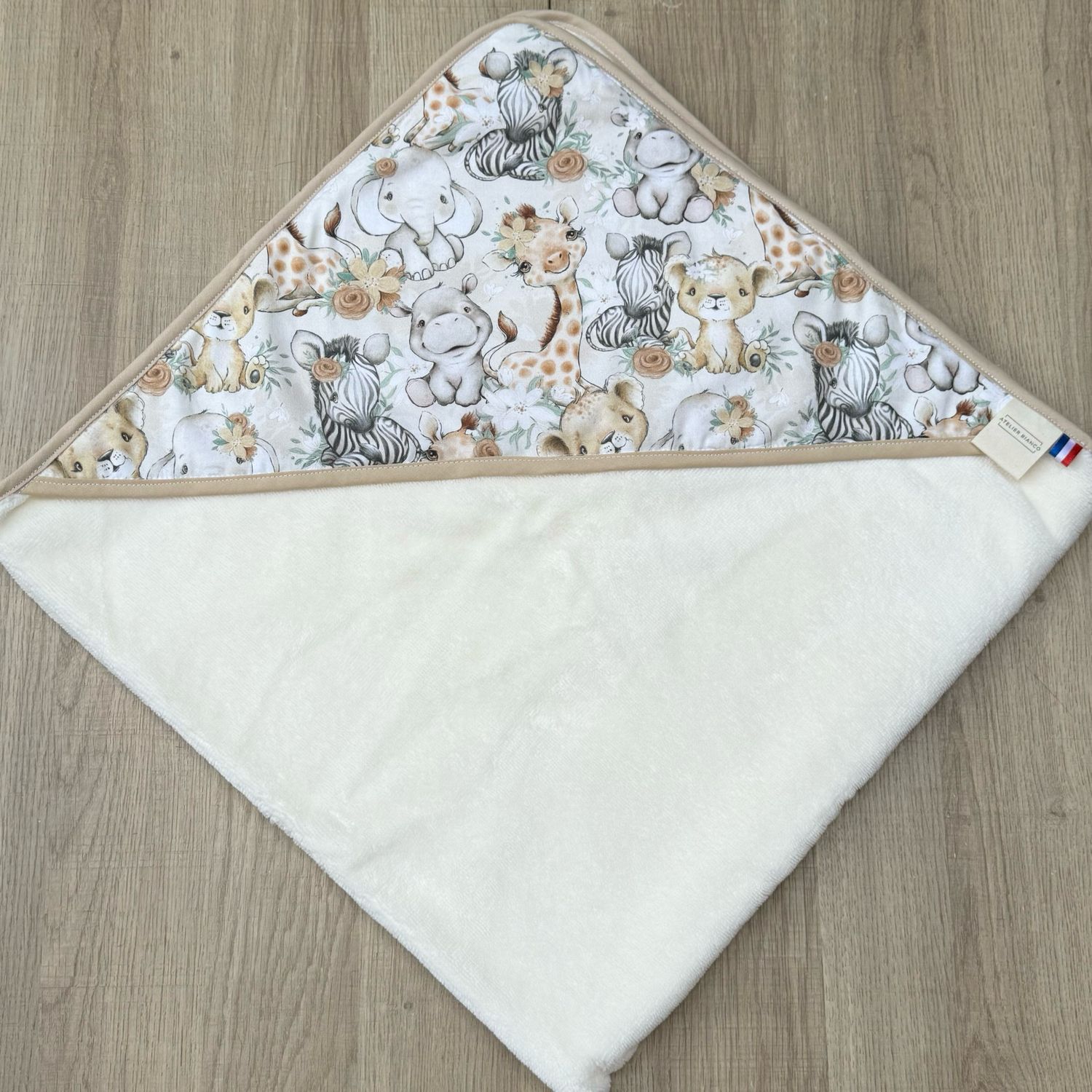 Cape de bain bébé - Motifs Savane beige fleurie