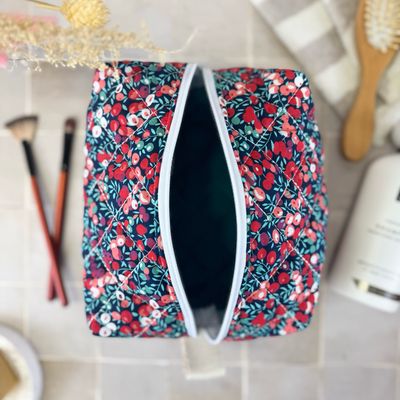 Trousse de toilette matelassée à motifs fleuris