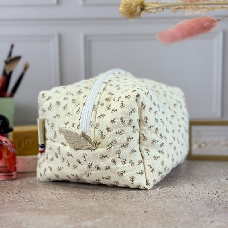 Trousse de toilette matelassée à motifs feuillage
