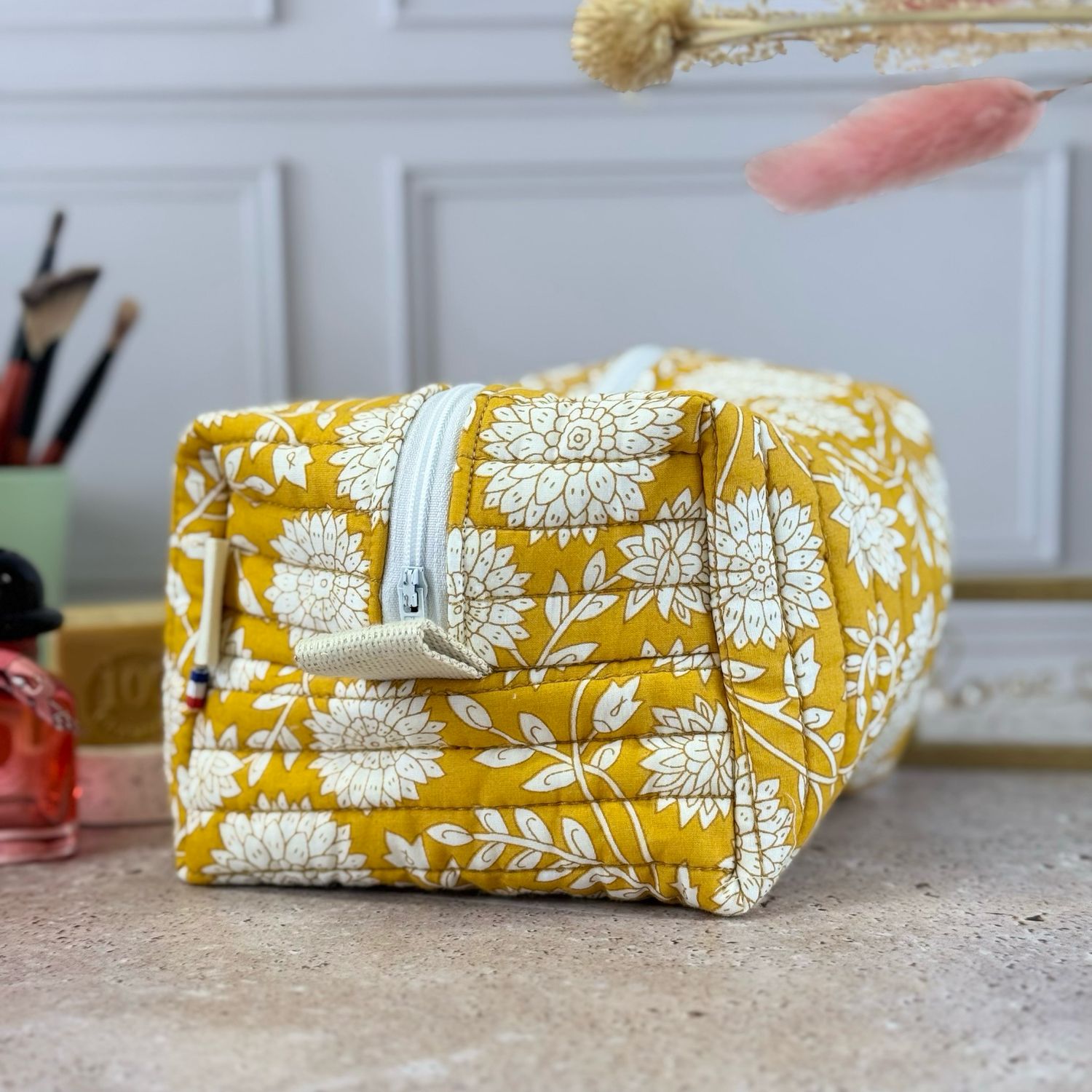 Trousse de toilette matelassée à motifs fleuris