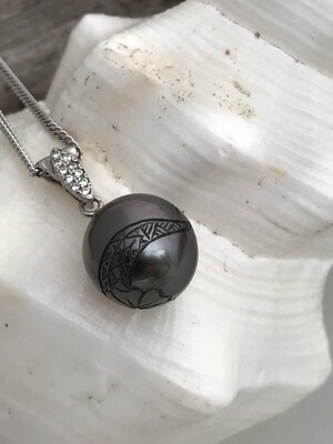 Carved black pearl