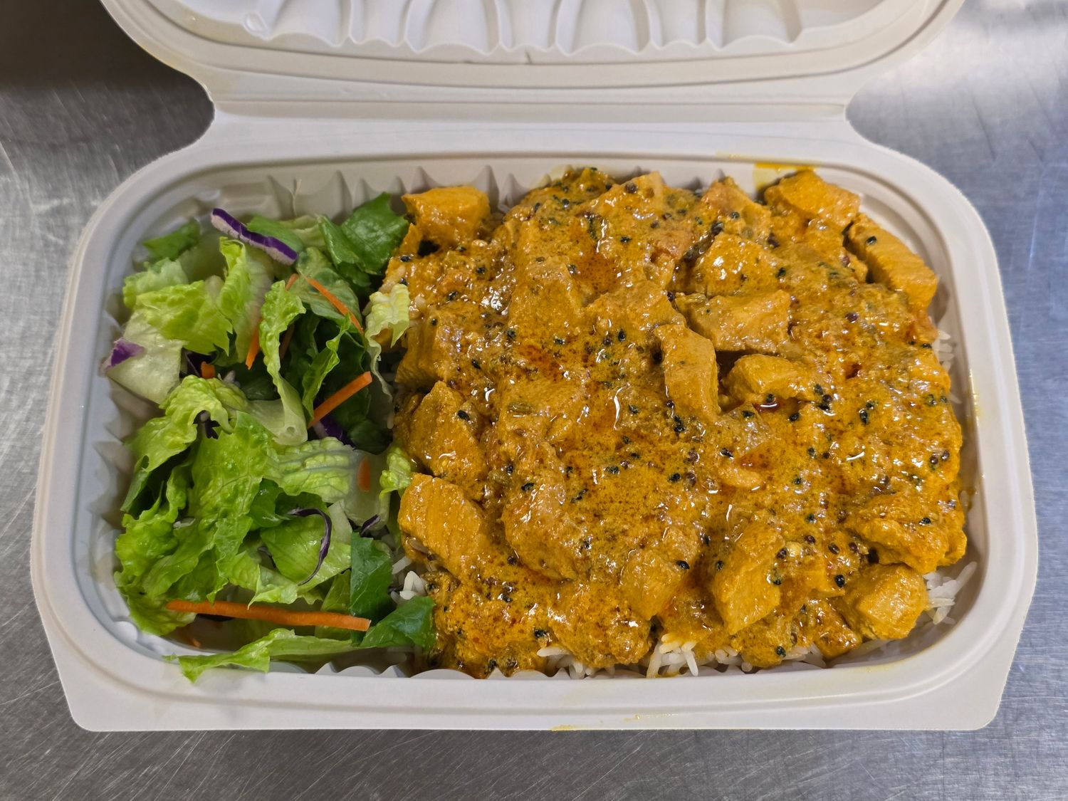 Chicken Achari over Rice