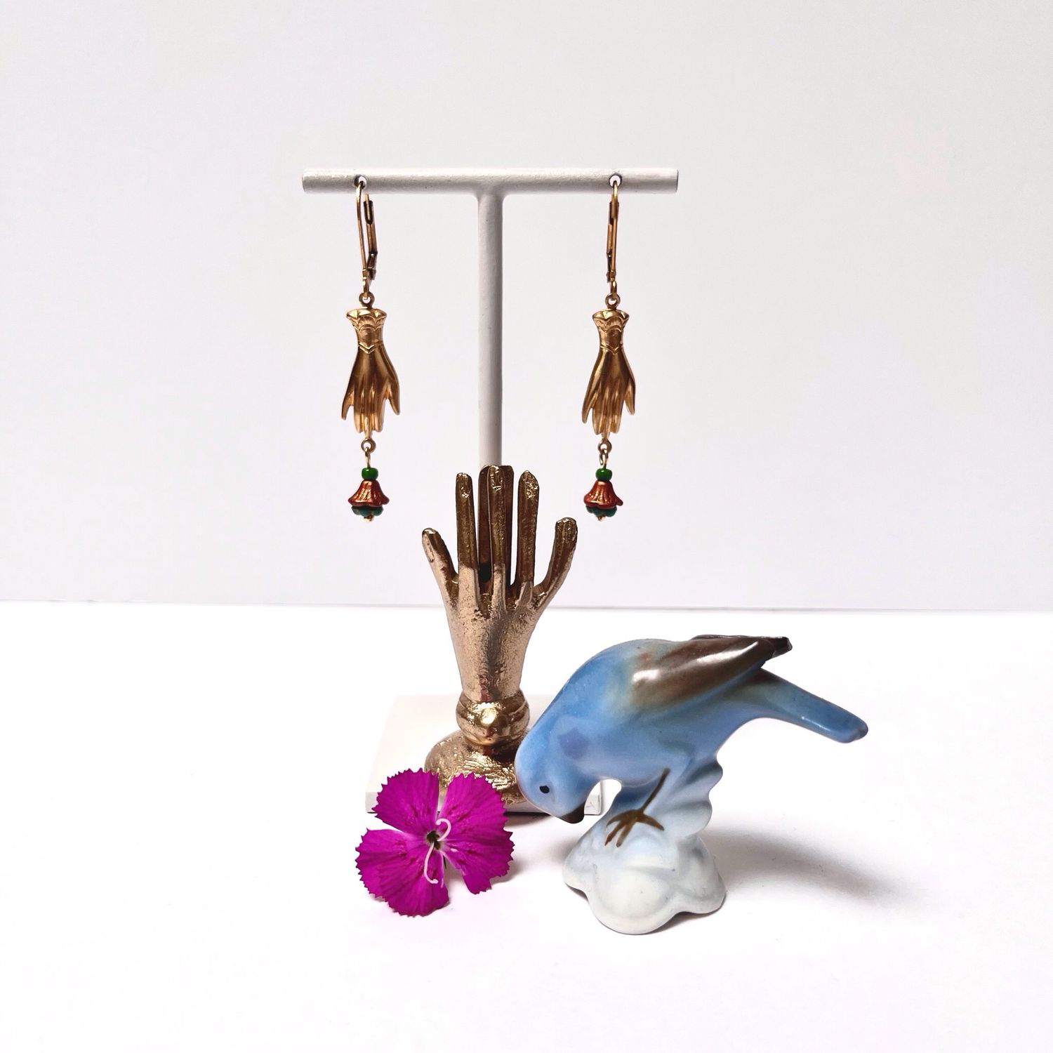 Helping hand flower cup earrings.
