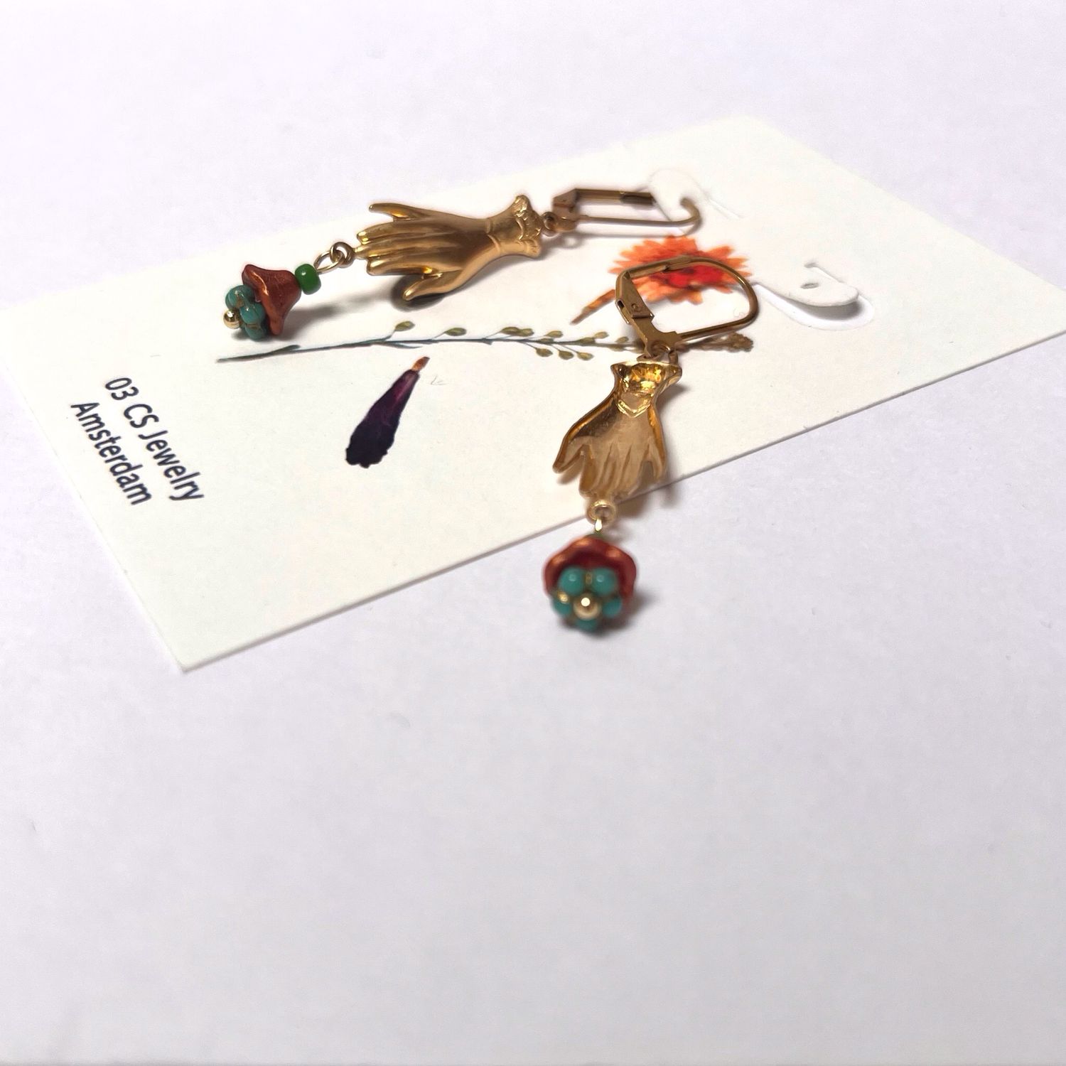 Helping hand flower cup earrings.