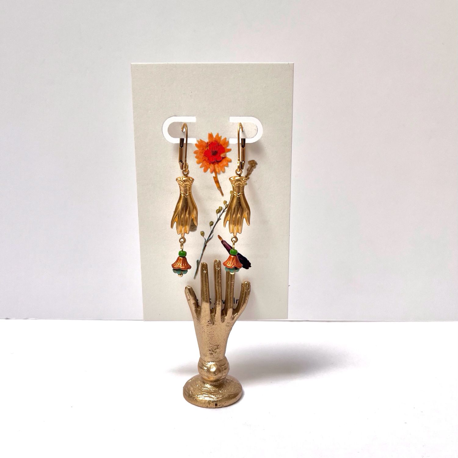 Helping hand flower cup earrings.