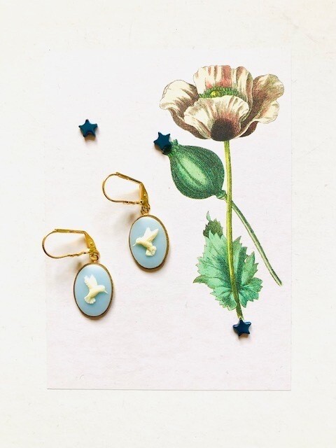 Cameo hummingbird  baby blue earrings.