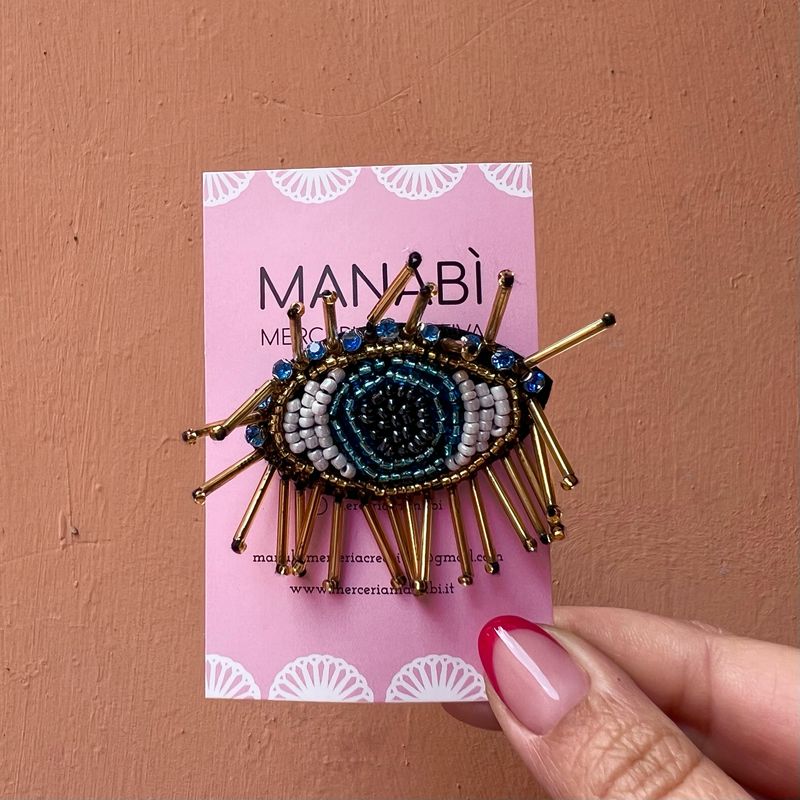 Spilla Manabì Occhio con canottiglie Spilla Manabì Occhio con canottiglie