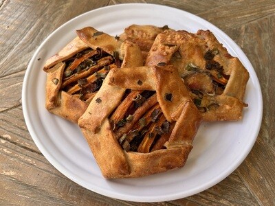 Savory Galette with Lacopi Beans, Spring Onions, Sauteed greens, and Cheese
