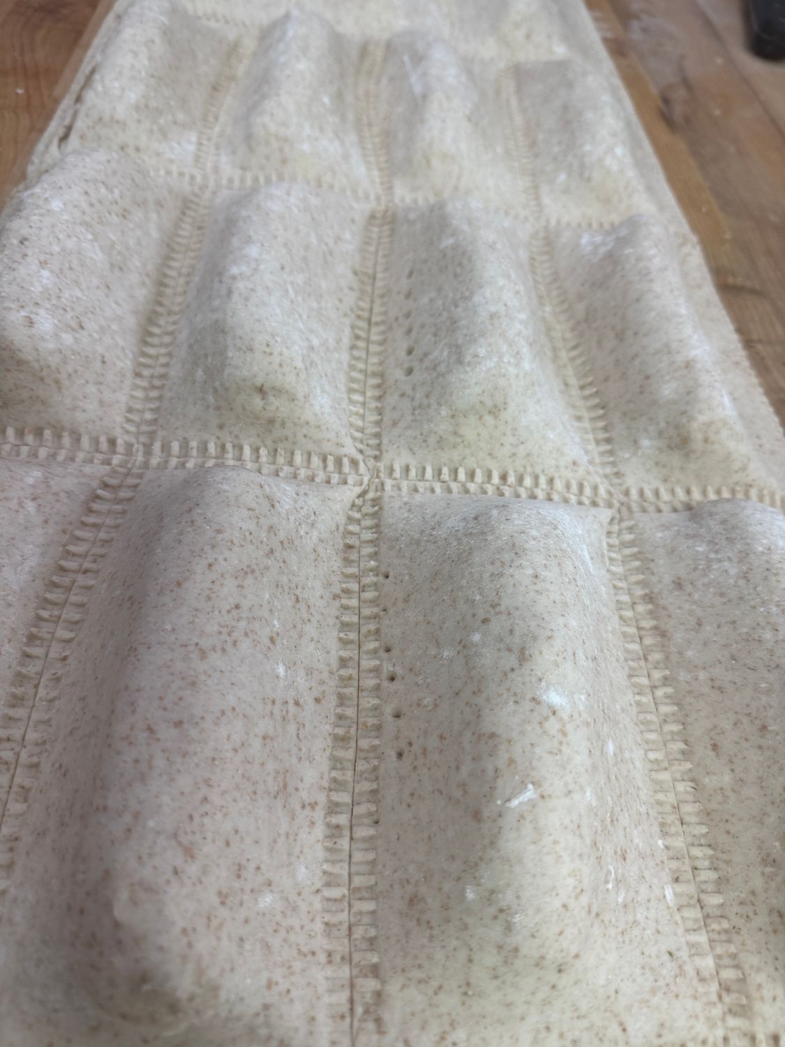 Fiddlers, new potatoes, twice baked, placed inside puff pastry. Ricotta, cheddar, cheese, green onions, bacon.