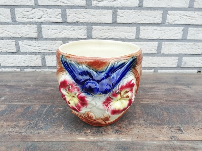 Vintage flower pot with swallows
