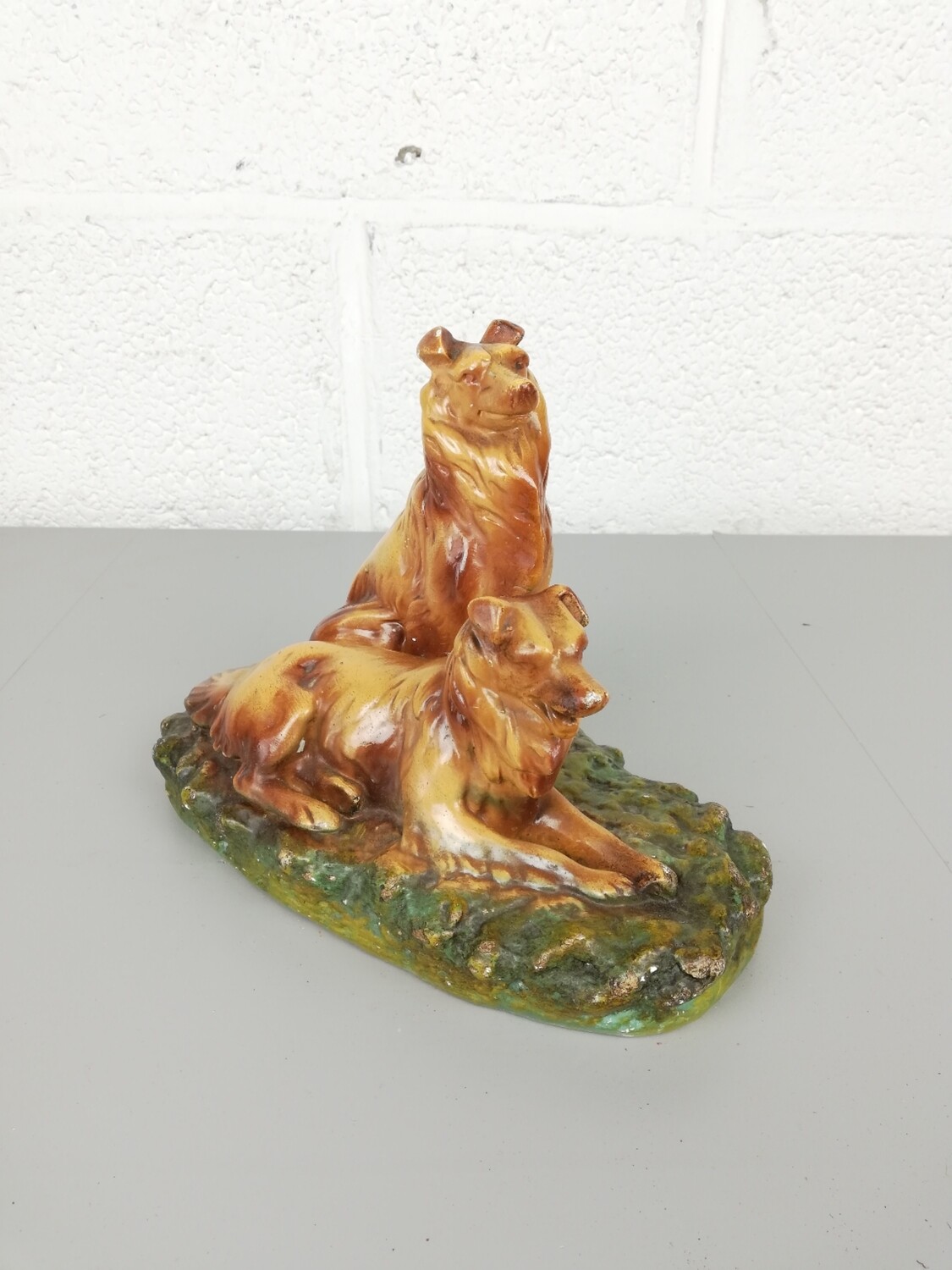 Old plaster statue dogs