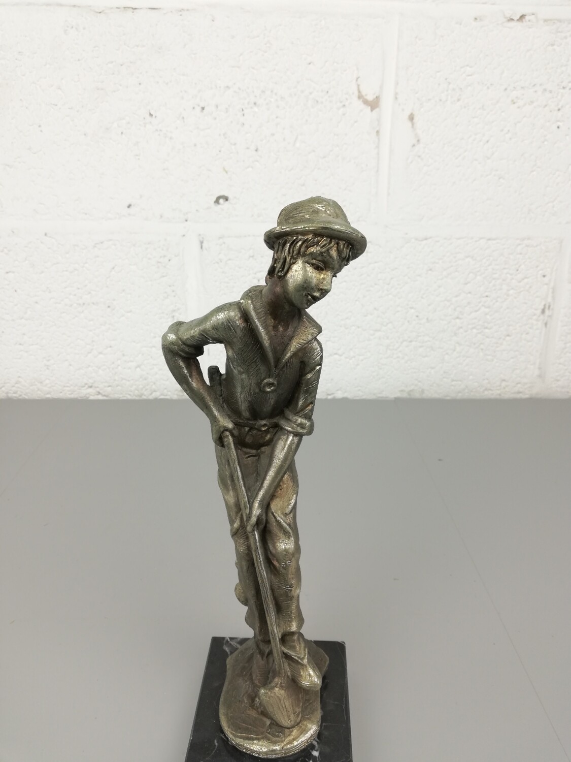 Figurine boy with shovel